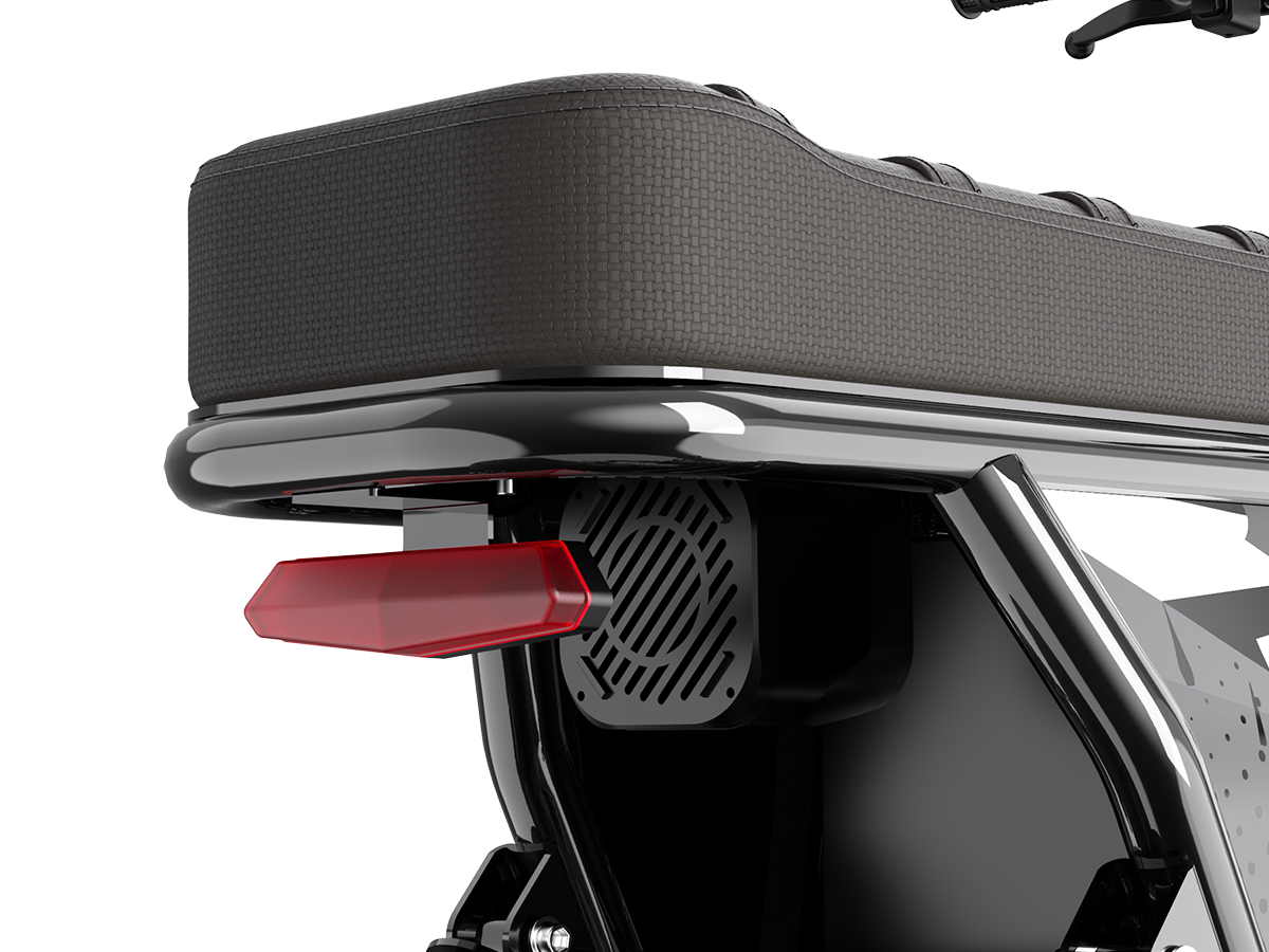 Close-up of the Jasion Poki Electric Mini Bike rear seat, red taillight and speaker grille
