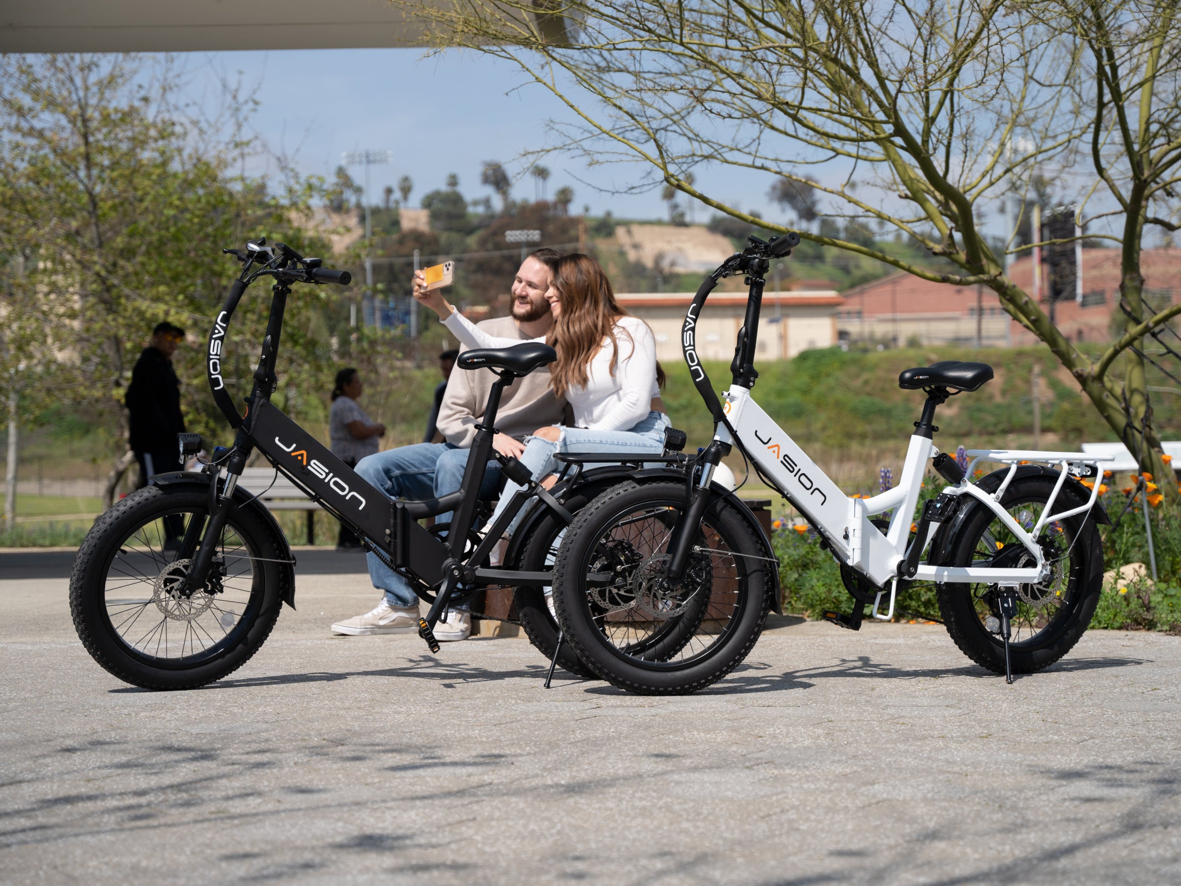 JasionBike EB7 ST folding electric bikes parked outdoors with accessories