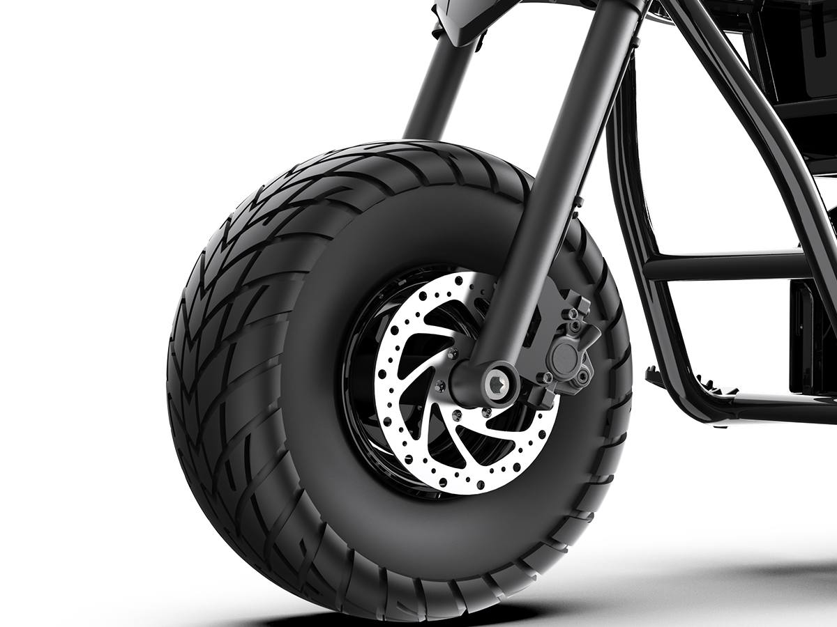 Close-up of the Jasion Poki Electric Mini Bike front tire, disc brake rotor and caliper