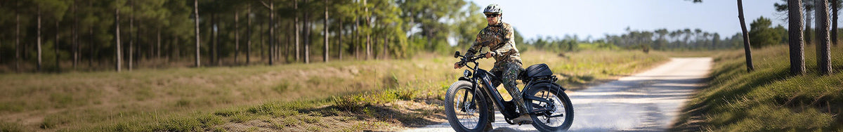 Jasion step-over electric bike ridden by rider in camouflage gear on forest trail, rugged fat-tire ebike for outdoor adventure